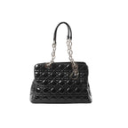 Black Dior Lady Dior large patent leather bag with Cannage quilting, silver-tone chain and leather handle straps, and hanging Dior letter charm