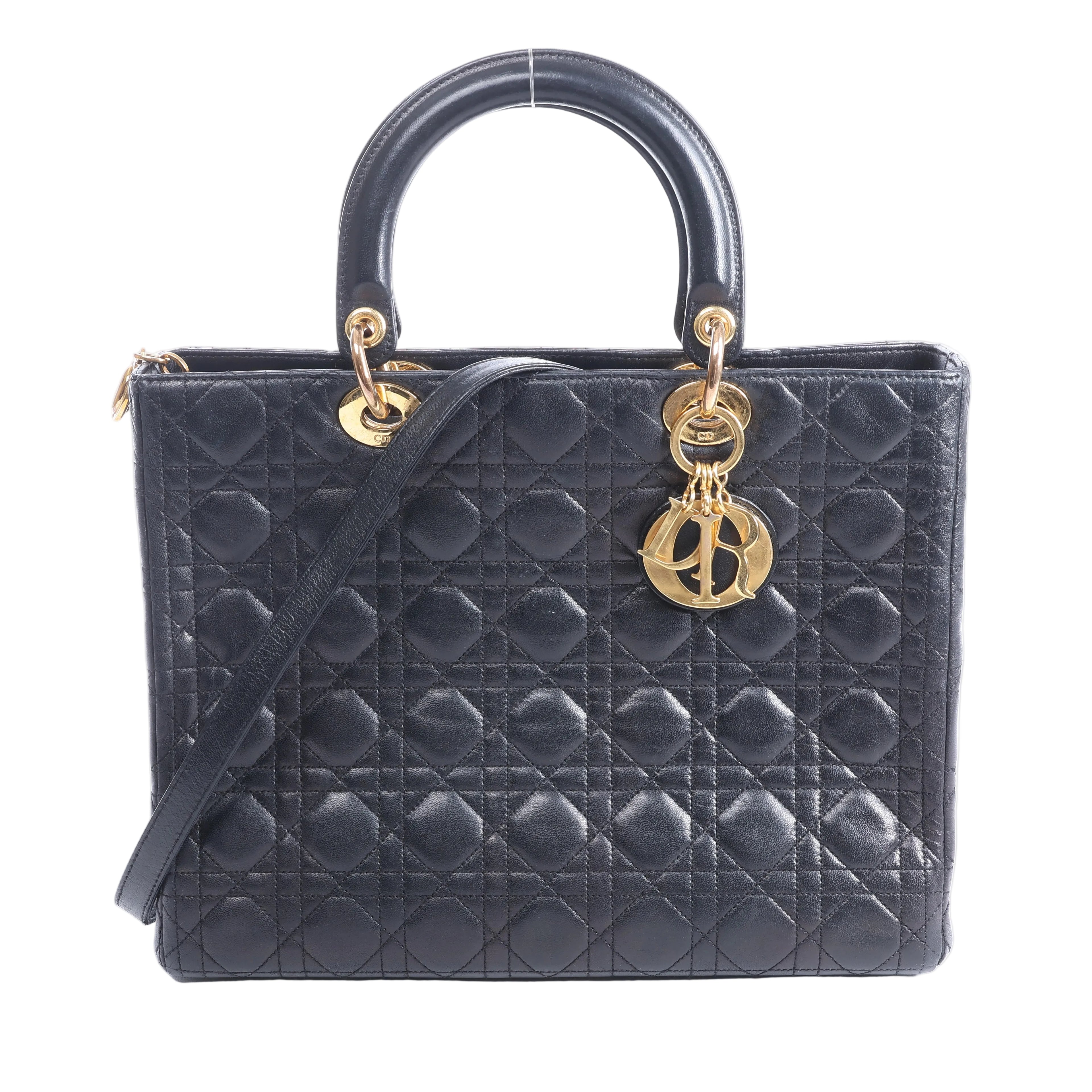 Black Christian Dior Lady Dior Large Cannage leather handbag with top handles, shoulder strap and gold-tone DIOR charms.