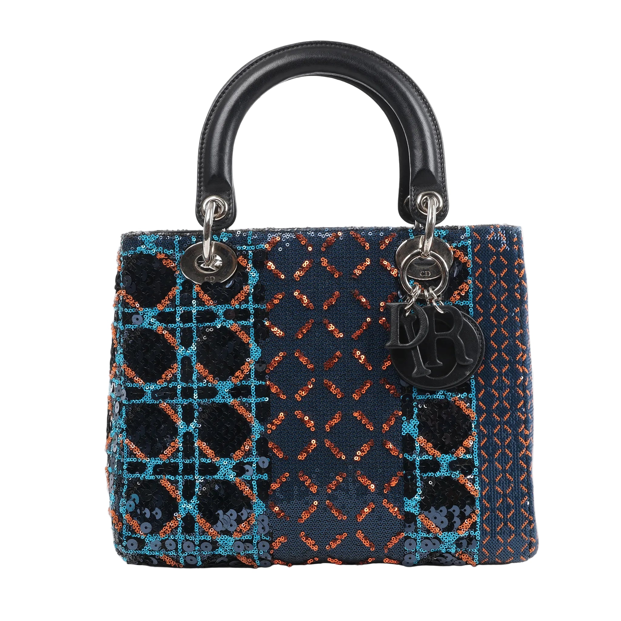 Front view of a Dior Lady Dior Medium Handbag in navy blue, embellished with orange, blue, and black sequins in geometric patterns, featuring black leather handles, silver-tone hardware, and hanging Dior letter charms, displayed against a white background.