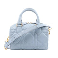 Dior MacroCannage Groove 20 handbag in light blue quilted leather with rounded top handles, a detachable strap and gold-tone hardware.