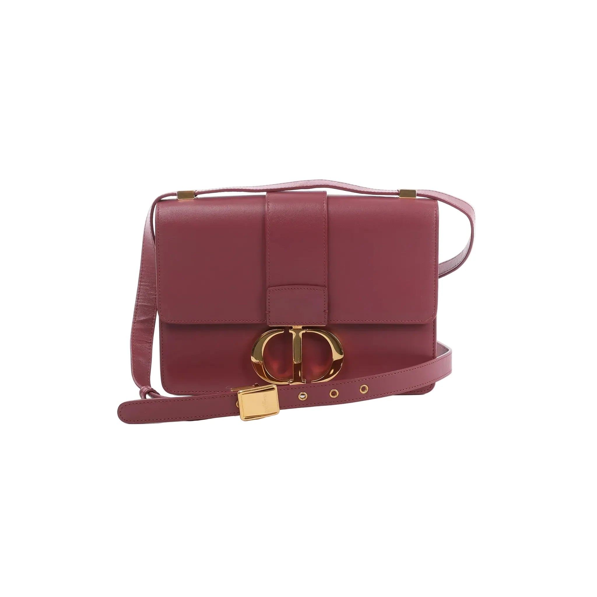Pink Dior 30 Montaigne leather crossbody bag with gold-tone CD clasp, flap front, and adjustable strap with gold buckle on white background.