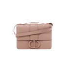 Front view of Christian Dior 30 Montaigne powder beige textured leather bag with a flap front, tonal CD clasp and matching leather strap.