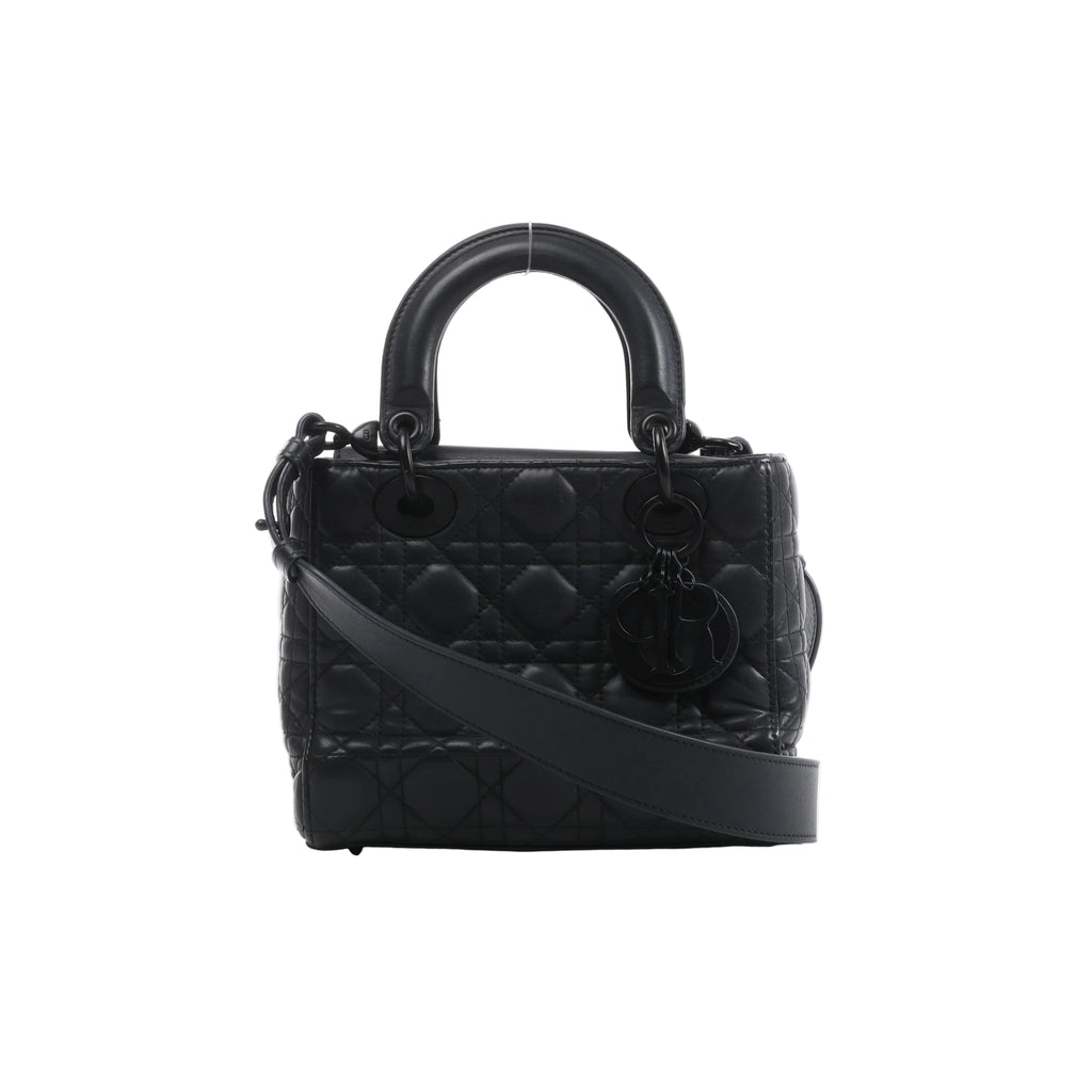 Front view of Christian Dior My Lady Dior black leather handbag with Cannage quilting, rounded handles, black DIOR charms and a broad shoulder strap.
