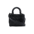 Front view of Christian Dior My Lady Dior black leather handbag with Cannage quilting, rounded handles, black DIOR charms and a broad shoulder strap.