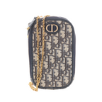 Navy Christian Dior Oblique canvas phone holder with dark leather trim, gold-tone CD logo, zip closure and gold-tone chain shoulder strap.