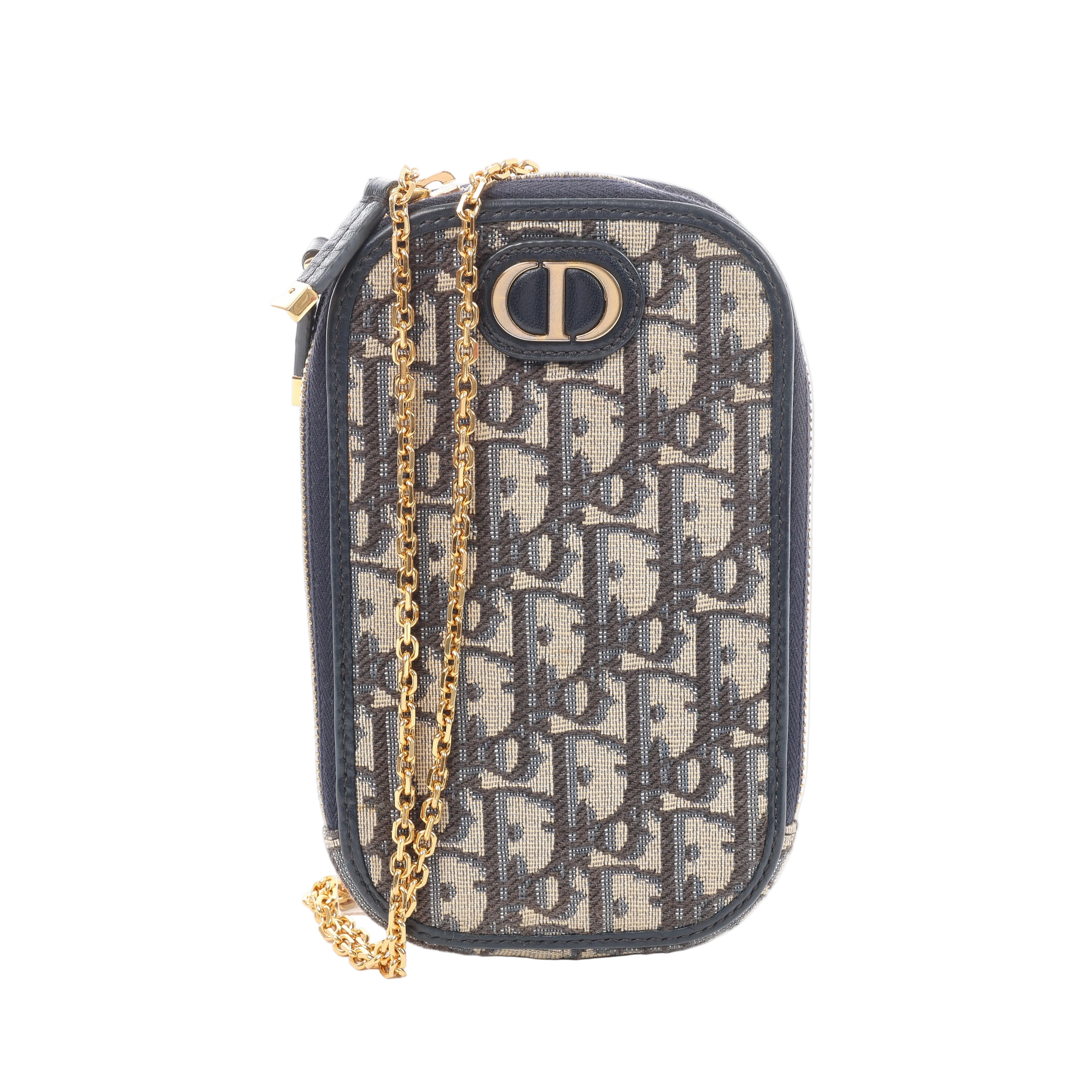 Navy Christian Dior Oblique canvas phone holder with dark leather trim, gold-tone CD logo, zip closure and gold-tone chain shoulder strap.