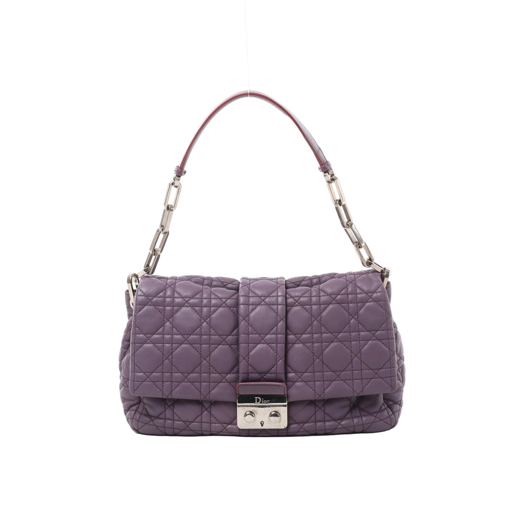Front view of a purple Christian Dior New Lock leather shoulder bag with Cannage quilting, silver-tone chain links and a Dior clasp.