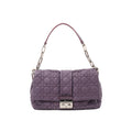 Front view of a purple Christian Dior New Lock leather shoulder bag with Cannage quilting, silver-tone chain links and a Dior clasp.