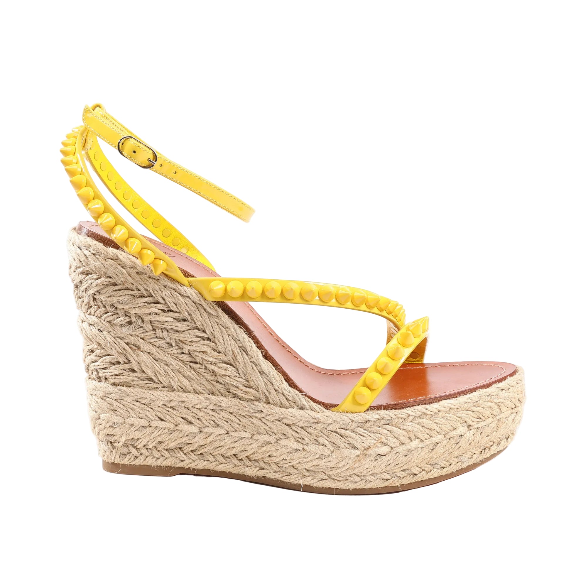 Christian Louboutin Mafaldina Zeppa sandals in yellow patent leather with ankle strap, silver spike studs, and braided wedge espadrille sole. Size 39 EU.