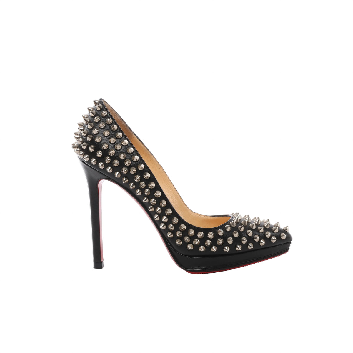 Side view of a black Christian Louboutin leather pump with silver-tone spike studs, a raised platform, slim stiletto heel and visible red sole.