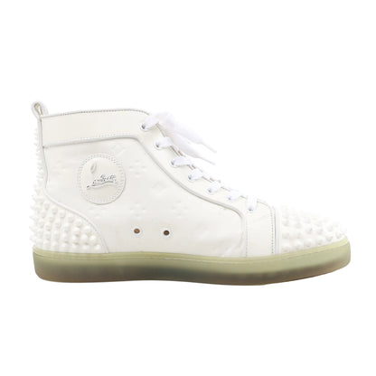Side view of a white Christian Louboutin leather high-top sneaker in size 42.5 EU, showcasing tonal rubber spikes on the toe and heel, white laces, embossed logo patch, and a translucent green-tinted sole.