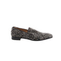 Side view of Christian Louboutin gray and black camouflage loafers with silver-tone spike studs, black trim and a low black heel.