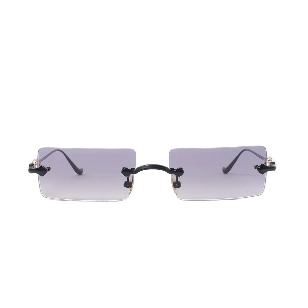 Rimless rectangular sunglasses with gray gradient lenses, black bridge and gold-tone side hardware on a white background.
