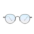 Chrome Hearts round sunglasses with black metal frames, light blue gradient lenses, and cross-style hinge accents on a white background.