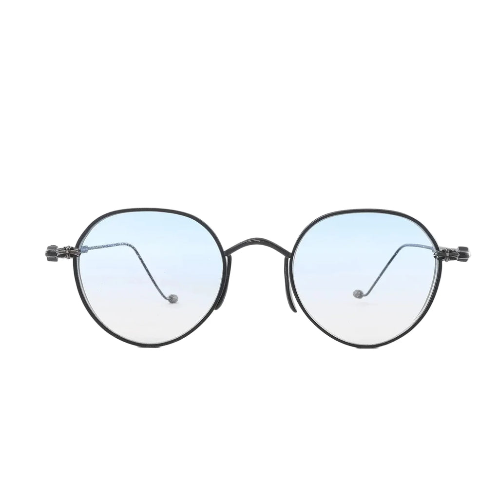 Chrome Hearts round sunglasses with black metal frames, light blue gradient lenses, and cross-style hinge accents on a white background.