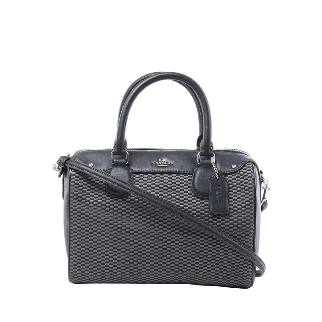 Front view of a gray patterned Coach Bennett Mini satchel with black leather trim, rolled handles, shoulder strap and logo hangtag.