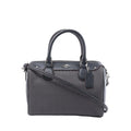 Front view of a gray patterned Coach Bennett Mini satchel with black leather trim, rolled handles, shoulder strap and logo hangtag.
