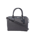 Front view of a gray patterned Coach Bennett Mini satchel with black leather trim, rolled handles, shoulder strap and logo hangtag.