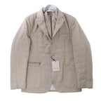 Corneliani beige wool quilted jacket with concealed zip and button front, classic collar, flap and zip pockets, long sleeves and tailored design, laid flat on a white background.