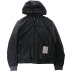 Corneliani reversible black leather hooded jacket with full-zip front, attached hood, zip pockets, ribbed knit cuffs and hem, laid flat on a white background.