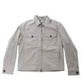 Greenish gray Corneliani jacket with pointed collar, front zip closure, two buttoned flap chest pockets and long sleeves.