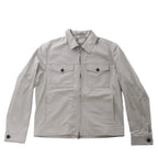 Greenish gray Corneliani jacket with pointed collar, front zip closure, two buttoned flap chest pockets and long sleeves.