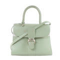 Green Delvaux Brillant MM leather handbag with structured top handle, shoulder strap and silver-tone signature buckle on a white background.