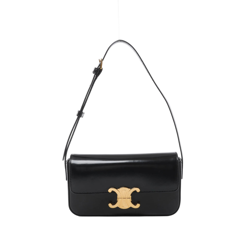 Black Celine Claude leather shoulder bag with a front flap, gold-tone Triomphe clasp and adjustable leather shoulder strap.
