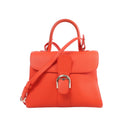 Orange Delvaux Brillant MM grained leather handbag with a curved top handle, matching shoulder strap, rounded front flap and silver-tone buckle.