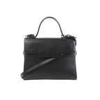 Delvaux Tempête GM black leather top-handle bag with structured flap front, tonal hardware details, and detachable shoulder strap on a white background.