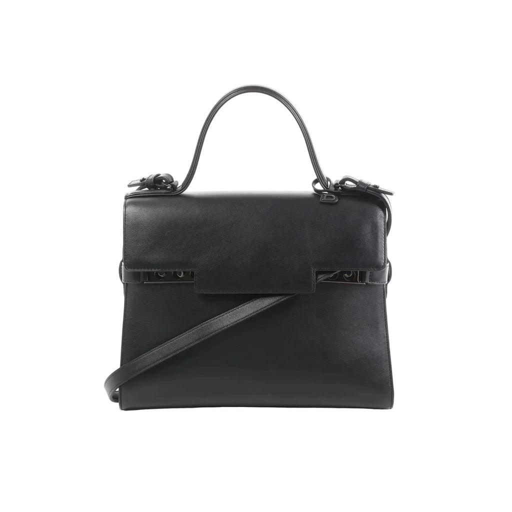 Delvaux Tempête GM black leather top-handle bag with structured flap front, tonal hardware details, and detachable shoulder strap on a white background.