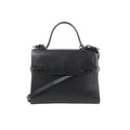 Delvaux Tempête GM black leather top-handle bag with structured flap front, tonal hardware details, and detachable shoulder strap on a white background.