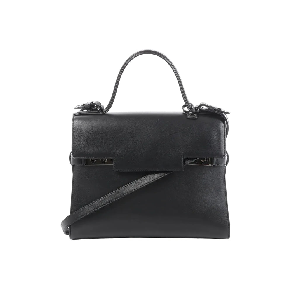 Delvaux Tempête GM black leather top-handle bag with structured flap front, tonal hardware details, and detachable shoulder strap on a white background.