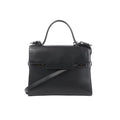Delvaux Tempête GM black leather top-handle bag with structured flap front, tonal hardware details, and detachable shoulder strap on a white background.