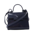 Front view of Delvaux Tempête Mini bag in glossy navy patent leather with top handle, adjustable shoulder strap, flap front, and riveted strap-style detailing.