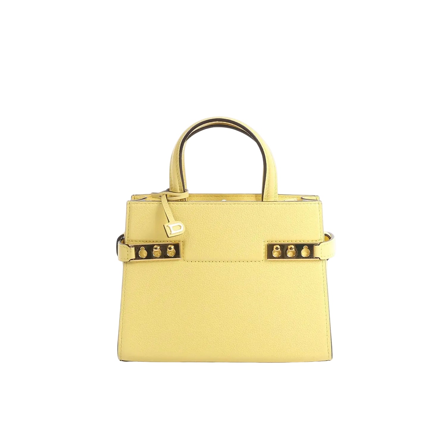 Delvaux Tempête PM yellow leather top-handle bag with gold-tone hardware, studded side accents, and a hanging “D” charm on a white background.