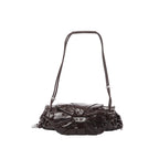 Burgundy Diesel Scrunch-D shoulder bag with glossy ruched leather, silver-tone buckle detail at center, and adjustable shoulder strap.