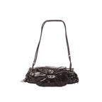 Burgundy Diesel Scrunch-D shoulder bag with glossy ruched leather, silver-tone buckle detail at center, and adjustable shoulder strap.
