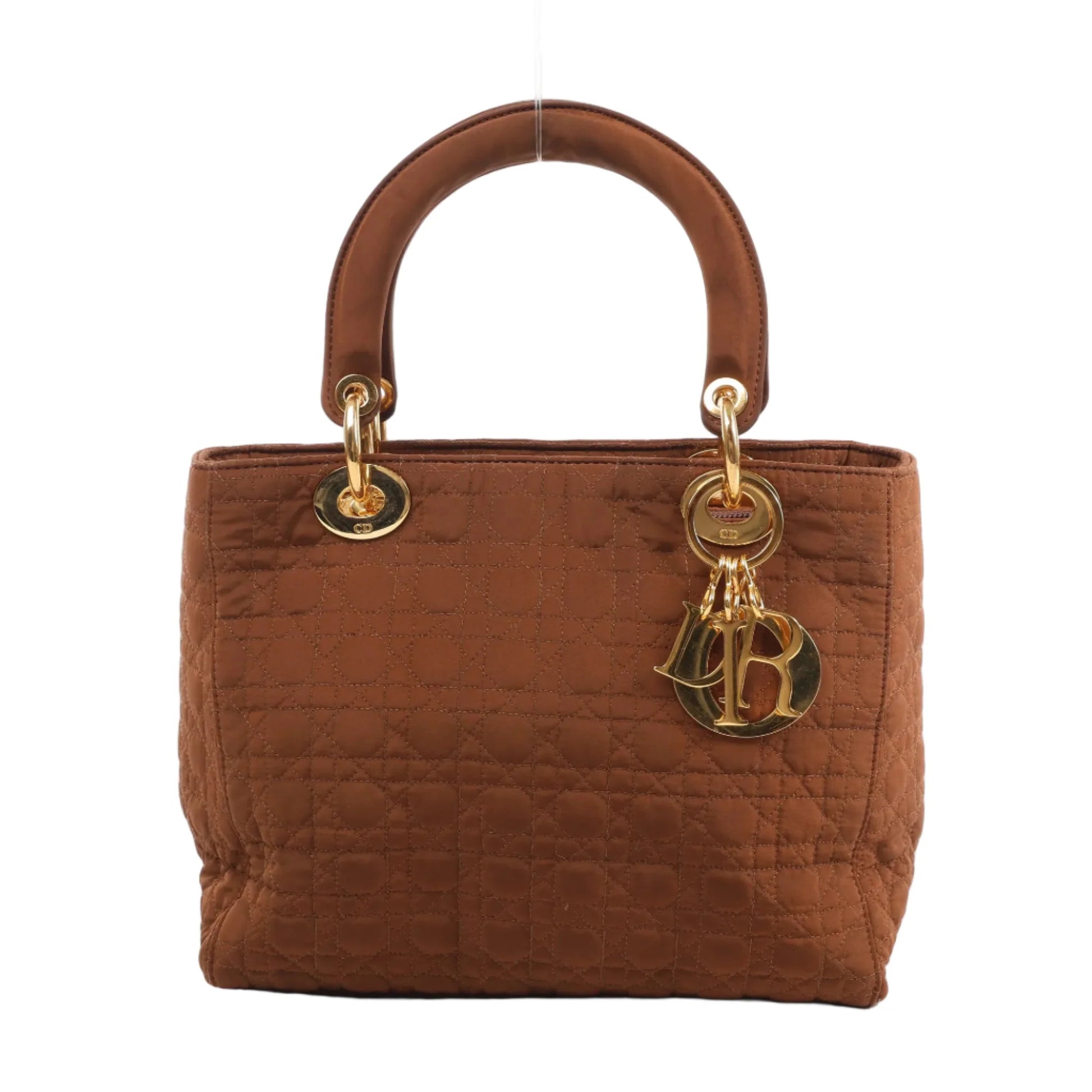 Front view of the Christian Dior Lady Dior Cannage Nylon Handbag in brown, showcasing quilted nylon with signature cannage stitching, dual rounded handles, gold-tone hardware, and dangling Dior letter charms, set against a white background.