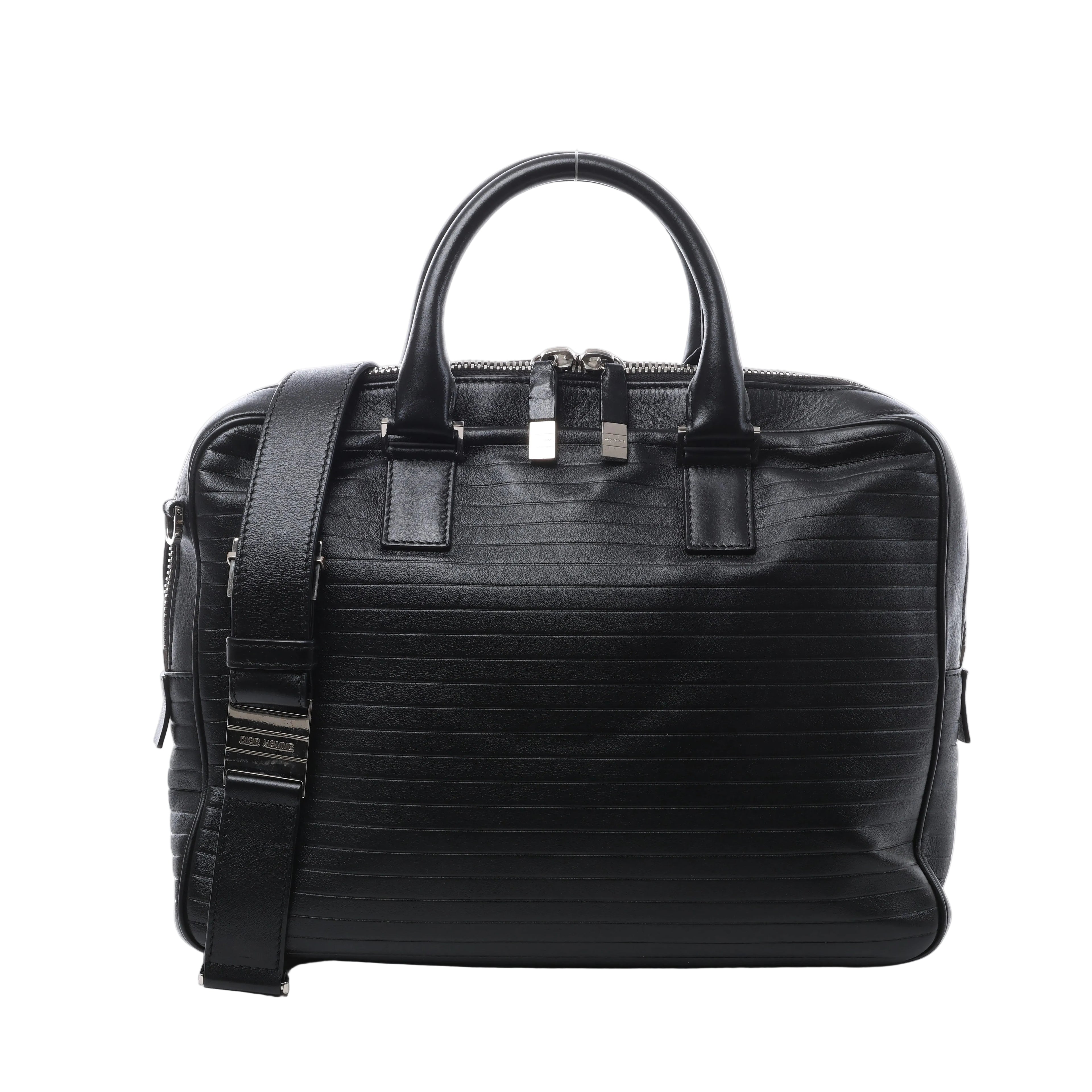 Black Dior Homme leather briefcase with horizontal stitched detailing, rounded top handles, wide shoulder strap and silver-tone zip hardware.