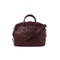 Burgundy Dior Homme leather business bag with rounded top handles, matching shoulder strap, zip closure and silver-tone hardware.