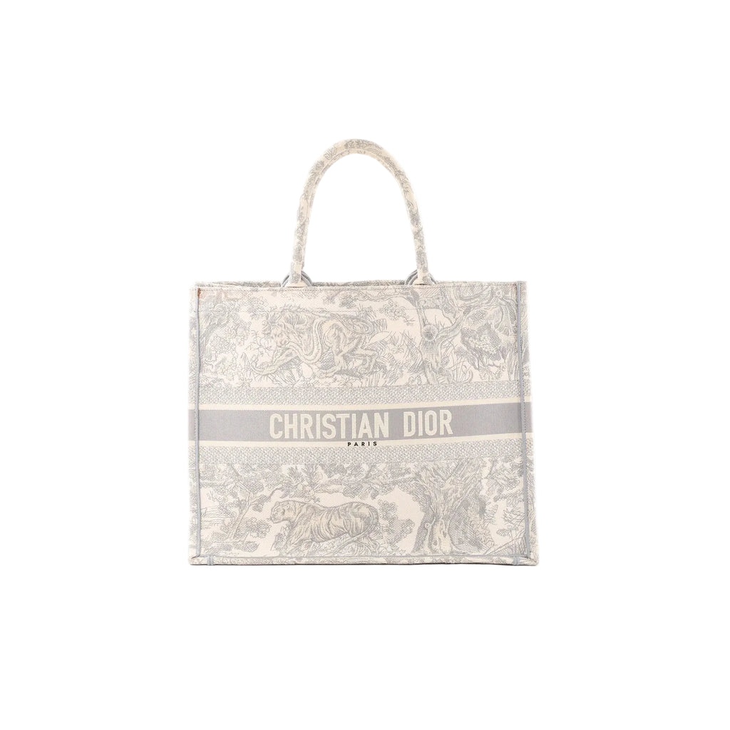 Dior Book Tote Large in gray toile Jouy embroidered canvas with top handles and “CHRISTIAN DIOR PARIS” logo band on the front.