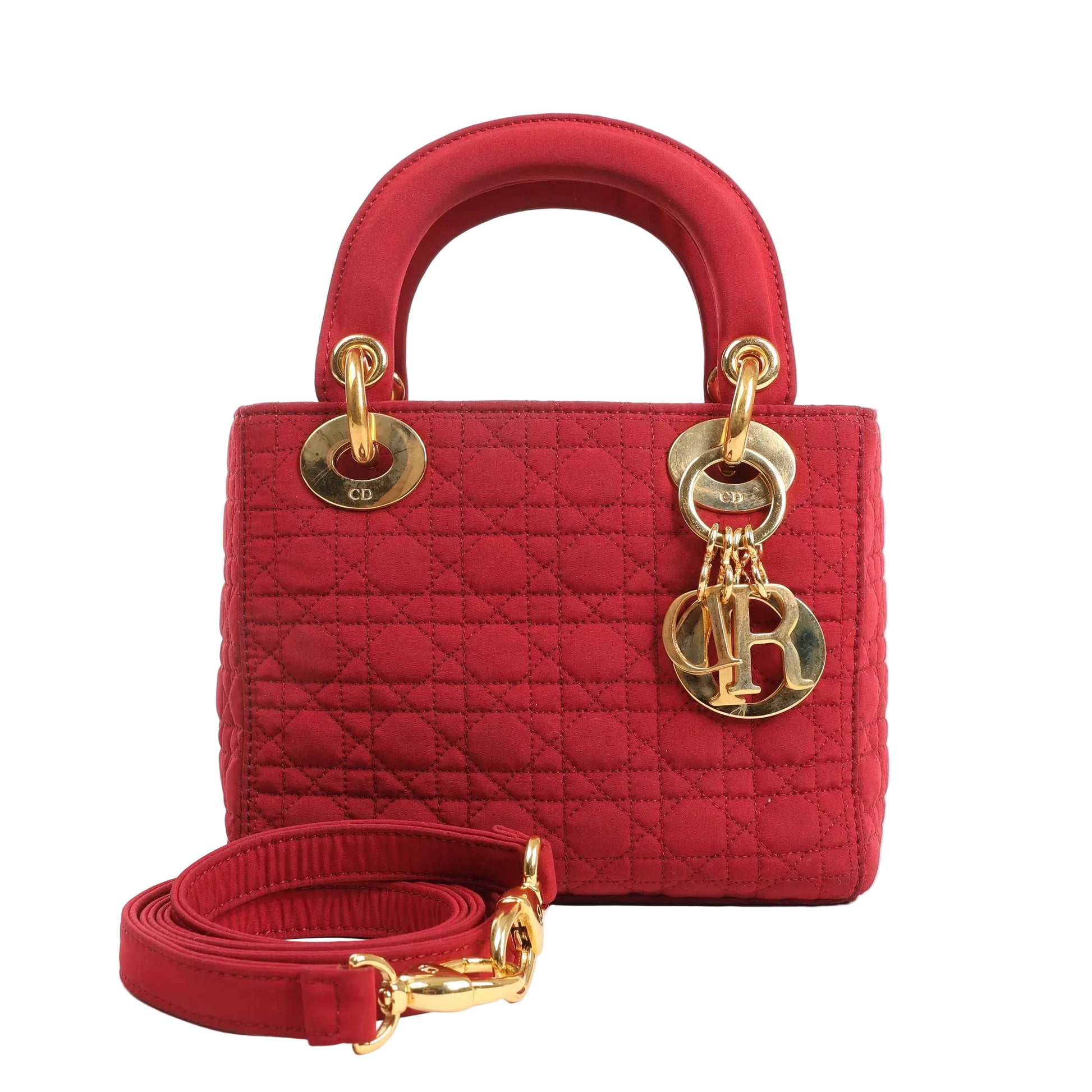 Front view of a Dior Lady Dior Mini handbag in red Cannage quilted nylon, featuring gold-tone hardware, Dior letter charms, and a detachable matching red strap.