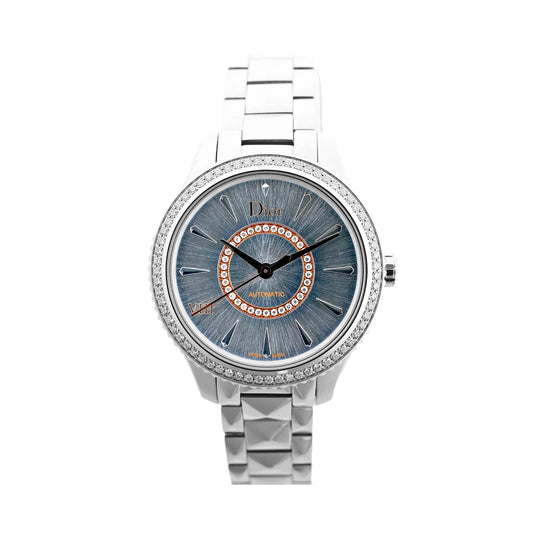 Dior Montaigne CD152510 FU6977 automatic watch with blue sunburst dial, diamond-set inner ring, silver-tone markers, stainless steel case and bracelet, shown on a white background.