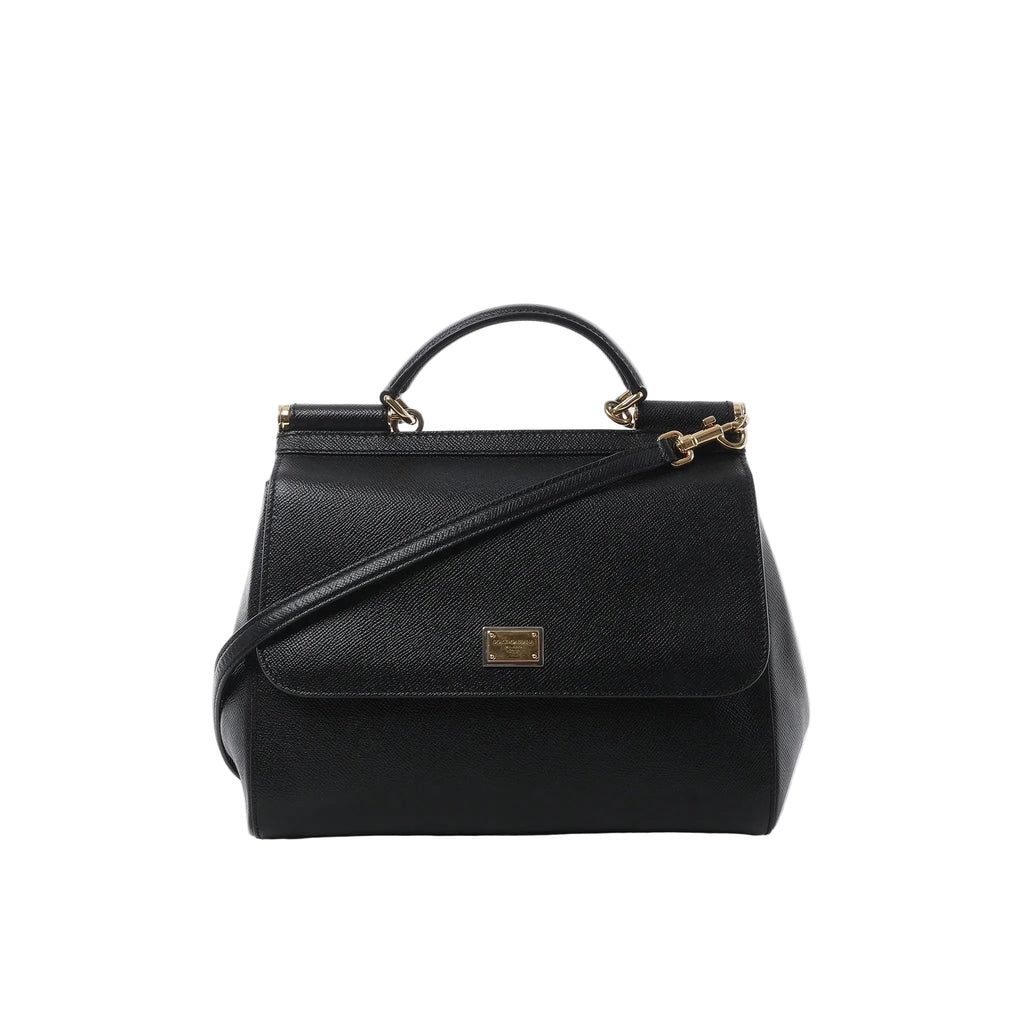Black textured leather Dolce & Gabbana Sicily handbag with top handle, detachable shoulder strap, flap front and gold-tone logo plaque on white background.