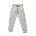 Eleventy light gray ribbed knit wool trousers with an elastic drawstring waistband, front patch pockets and ribbed cuffs, laid flat on a white background.