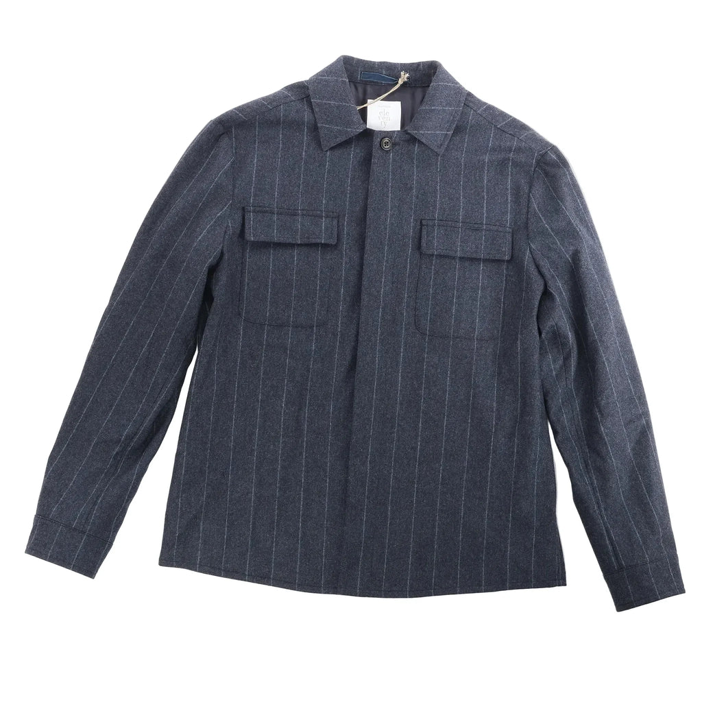 Eleventy navy pinstripe wool shirt with spread collar, long sleeves, and two flap chest pockets on a white background