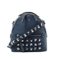Navy blue Fendi leather bag with a rounded top, silver-tone geometric studs, a matching studded shoulder strap, top handle and front zip pocket.