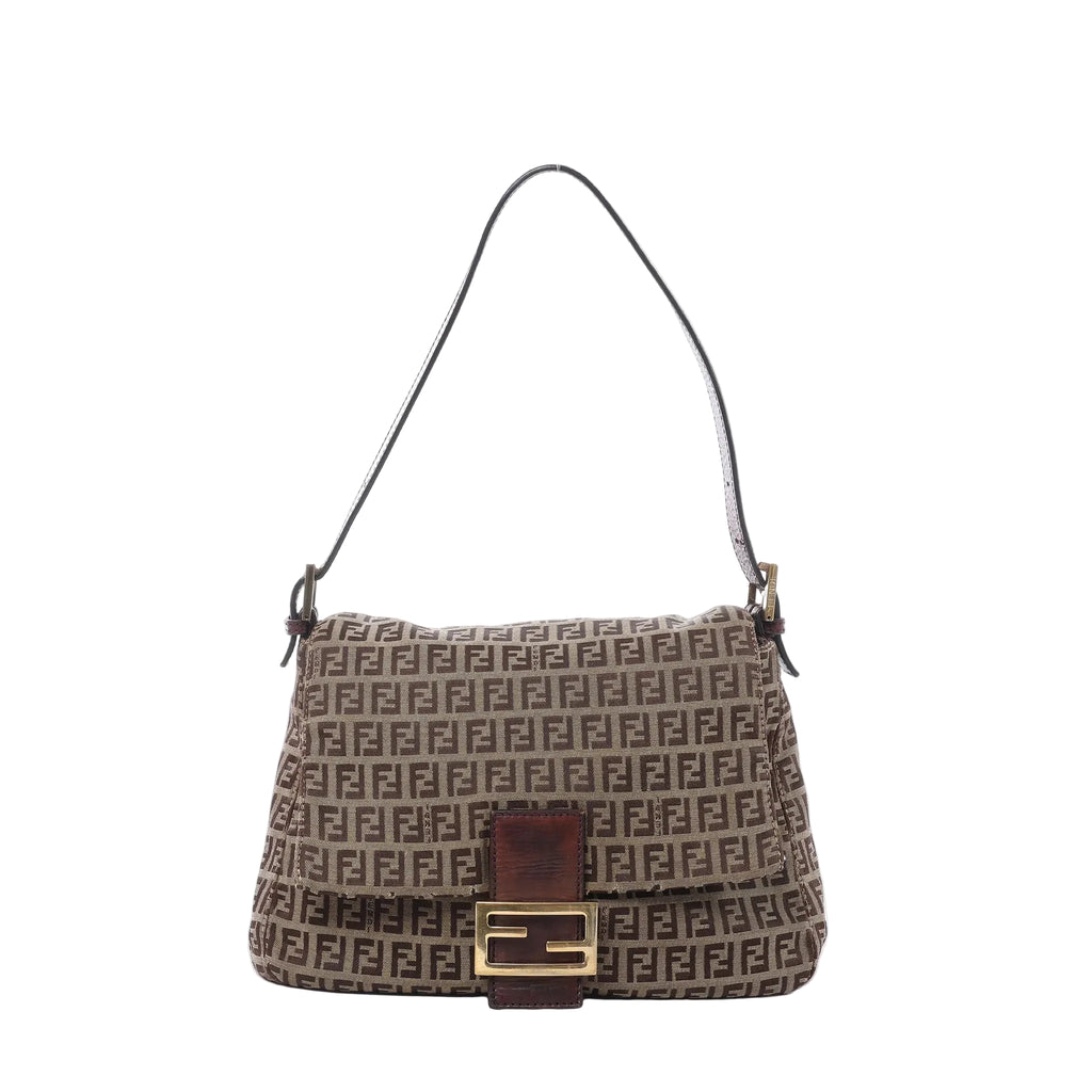 Fendi Mamma Baguette shoulder bag in brown Zucchino canvas with dark leather trim, slim shoulder strap, flap front, and gold-tone FF buckle on white background.