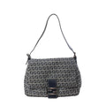 Fendi Mamma Baguette shoulder bag in navy blue and gray Zucchino canvas with black leather trim, slim shoulder strap, flap front, and silver-tone FF buckle on white background.